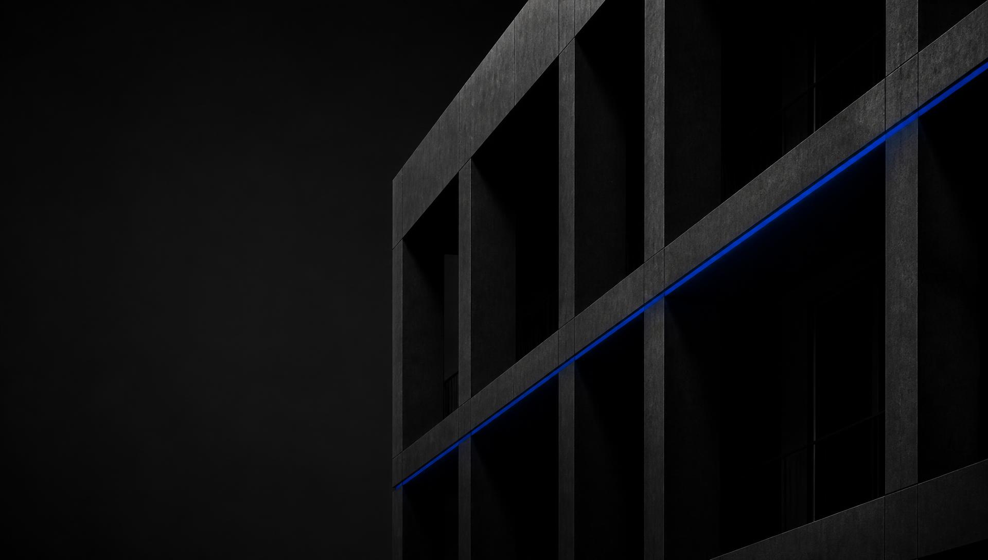 Estrutura arquitetônica em concreto com linha de luz azul royal